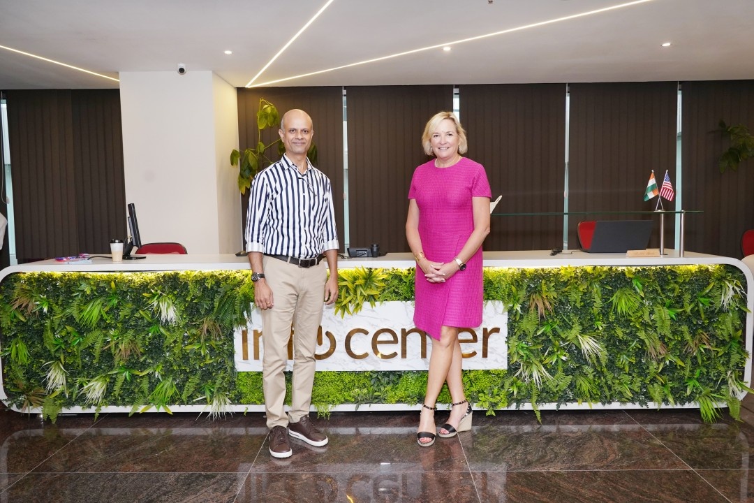 Joyce Mullen and a colleague at Infocenter’s Pune office reception during her 2024 visit