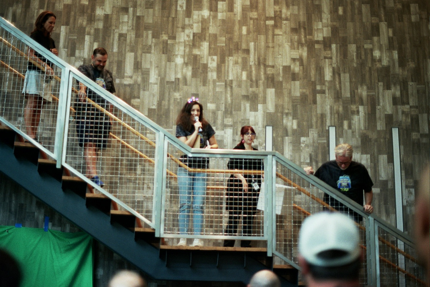 Infotech employees gathered on an indoor staircase during a company hackathon