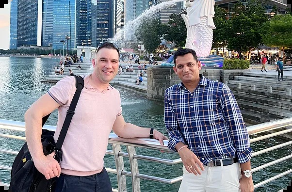 Two INFUSE colleagues beside Singapore’s Merlion waterfront