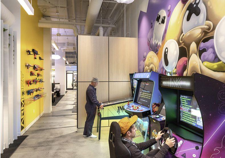 INK studio interior with arcade cabinets