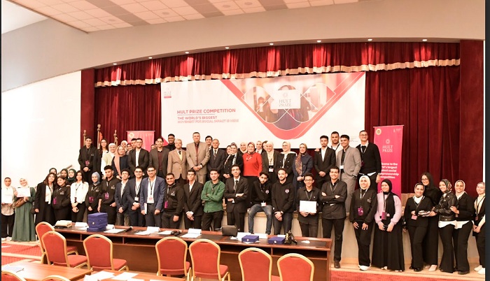 Participants and organizers gather on stage at Pharos University’s 2025 Hult Prize event.