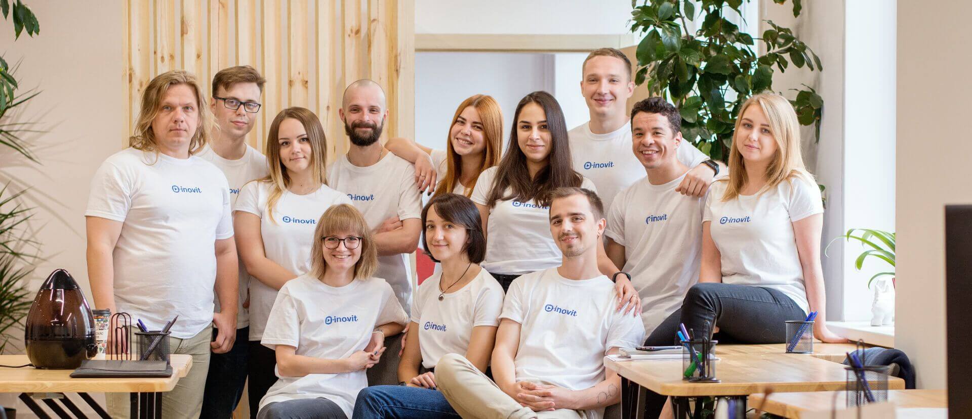 Company-published group photograph of INOVIT team members in an office