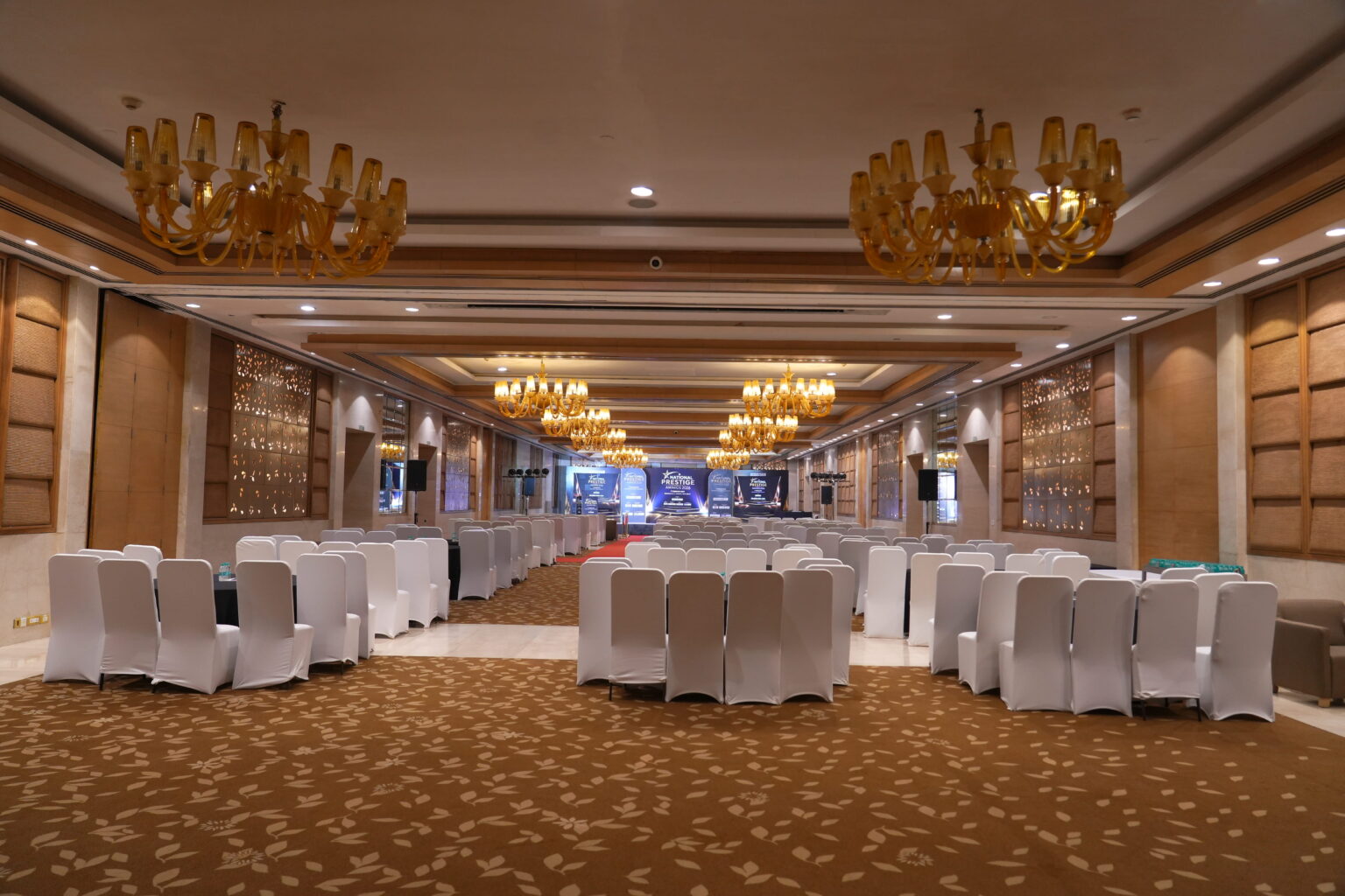 An empty ballroom prepared for an Insights Success Media awards event