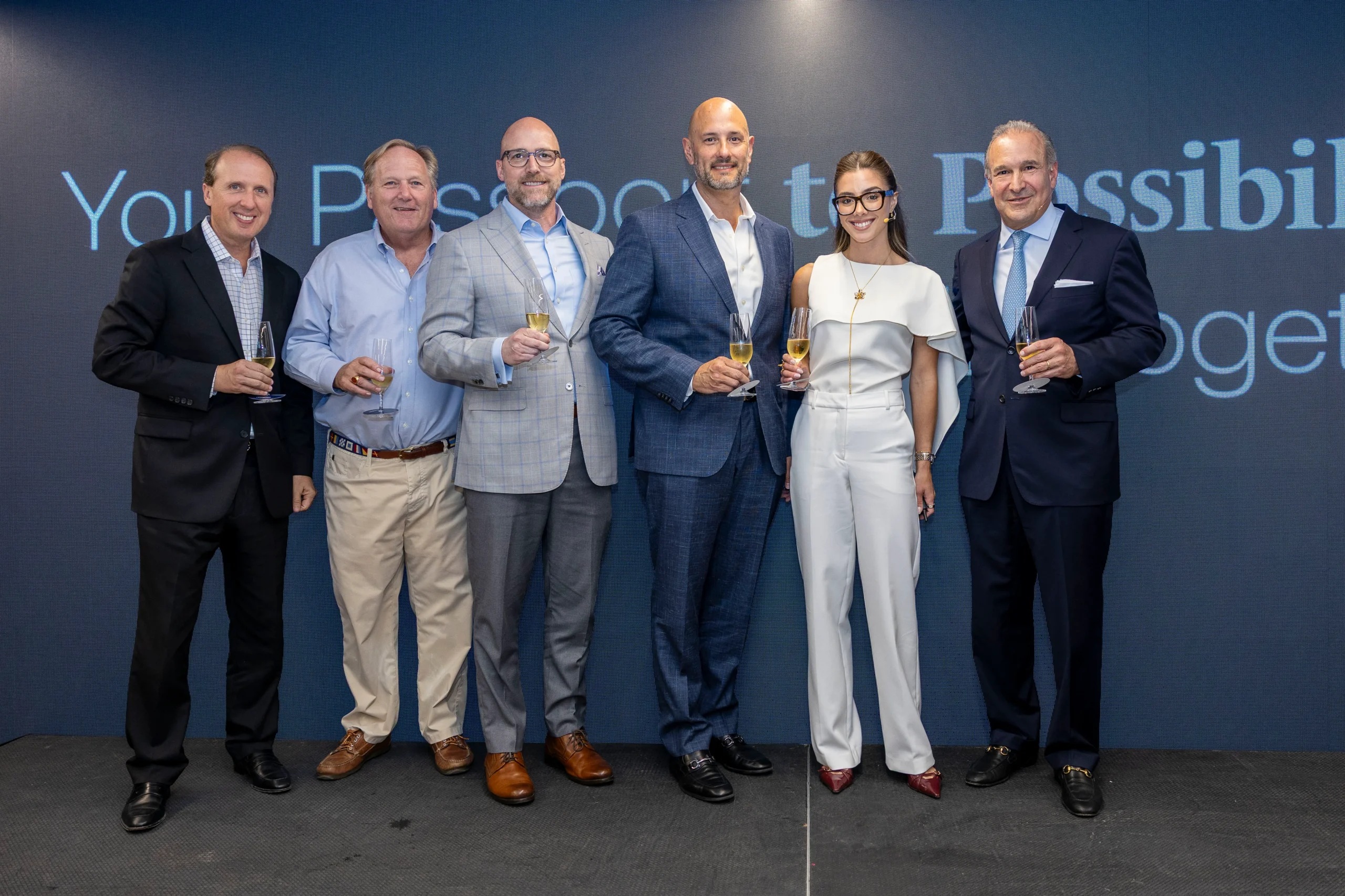 Insigneo team members celebrating the company’s new brand at its Miami launch event