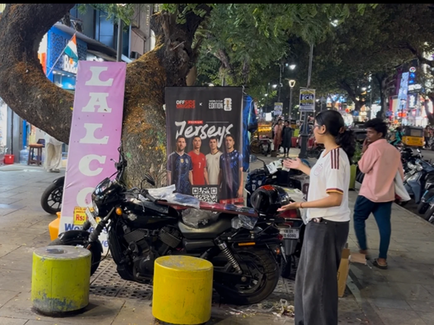 Students presenting an Offside Origins sales stall outdoors