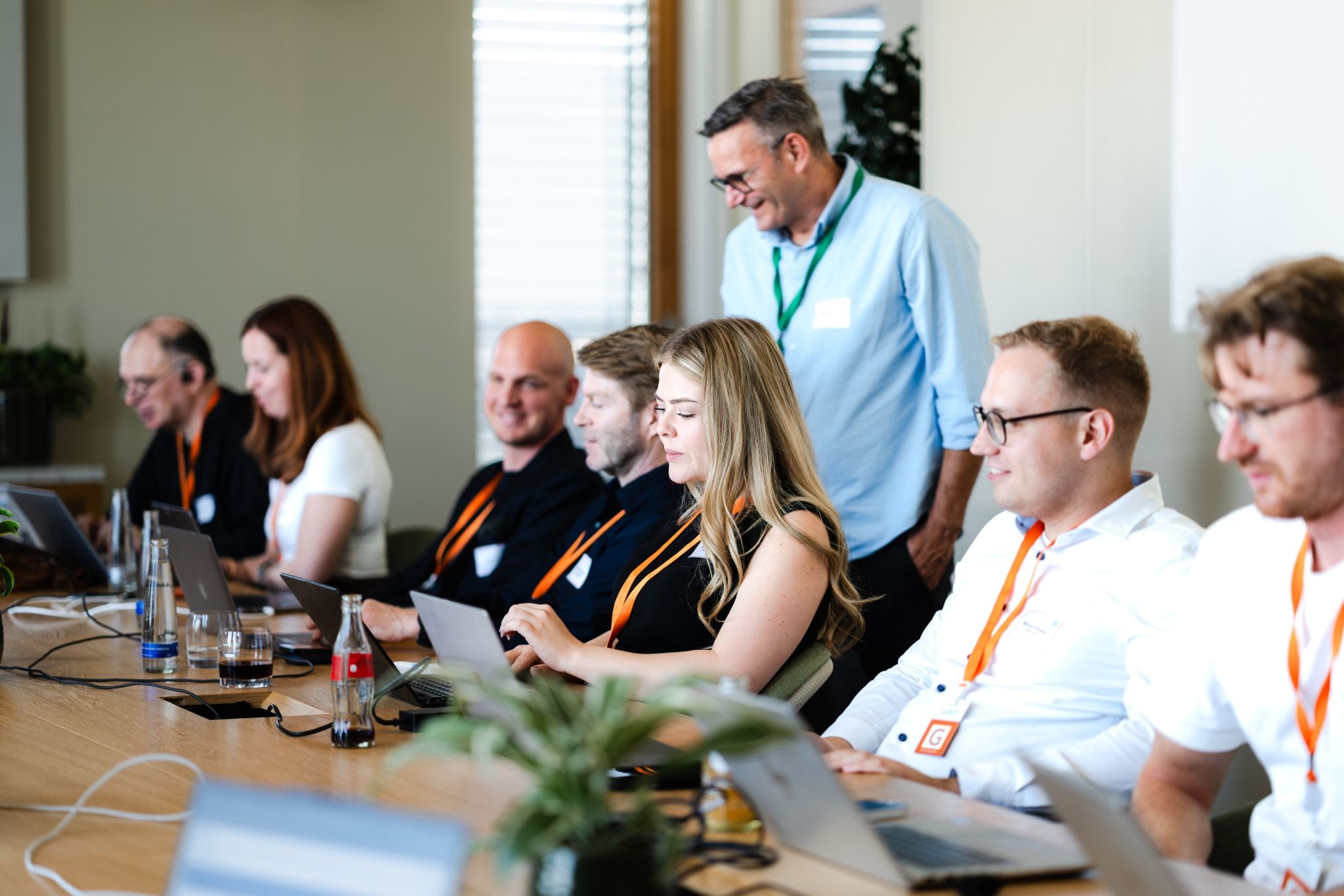 Participants working together on laptops at an ITHM and Salesforce AI hackathon