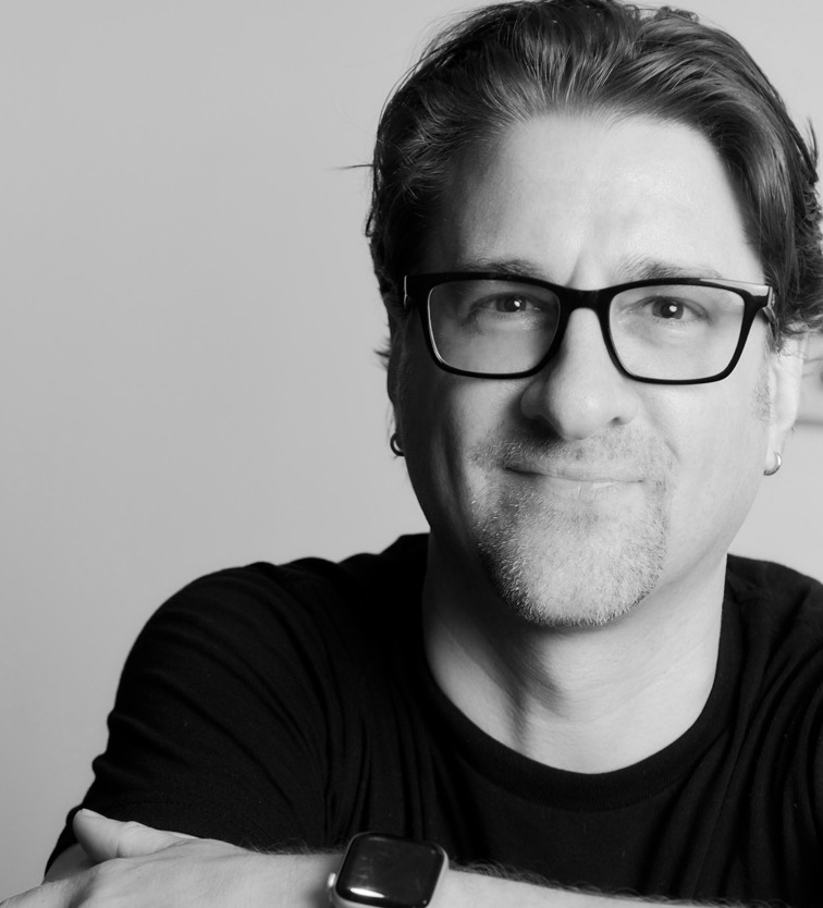 Black-and-white portrait of Integral founder Ethan McCarty