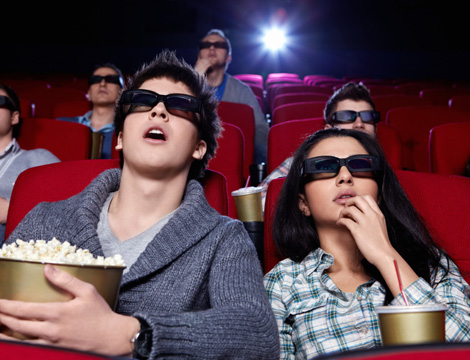 Cinema audience wearing 3D glasses during a screening