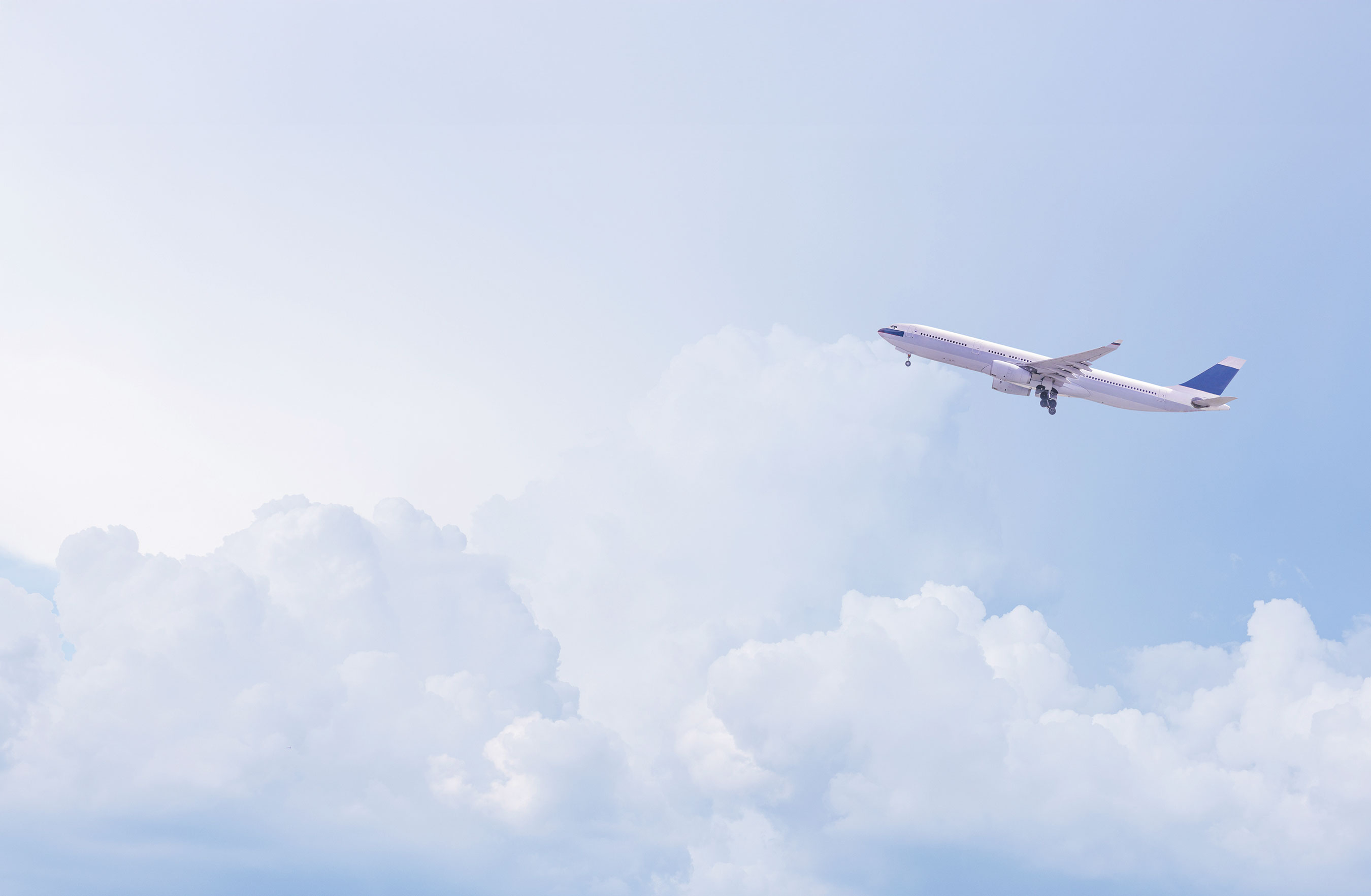 Passenger aircraft flying above the clouds