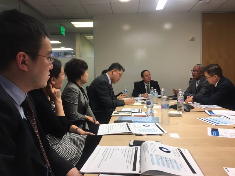 A business meeting photographed in a conference room