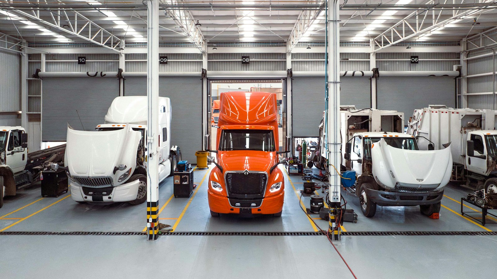 International employees inspecting an LT Series truck at the Escobedo manufacturing plant