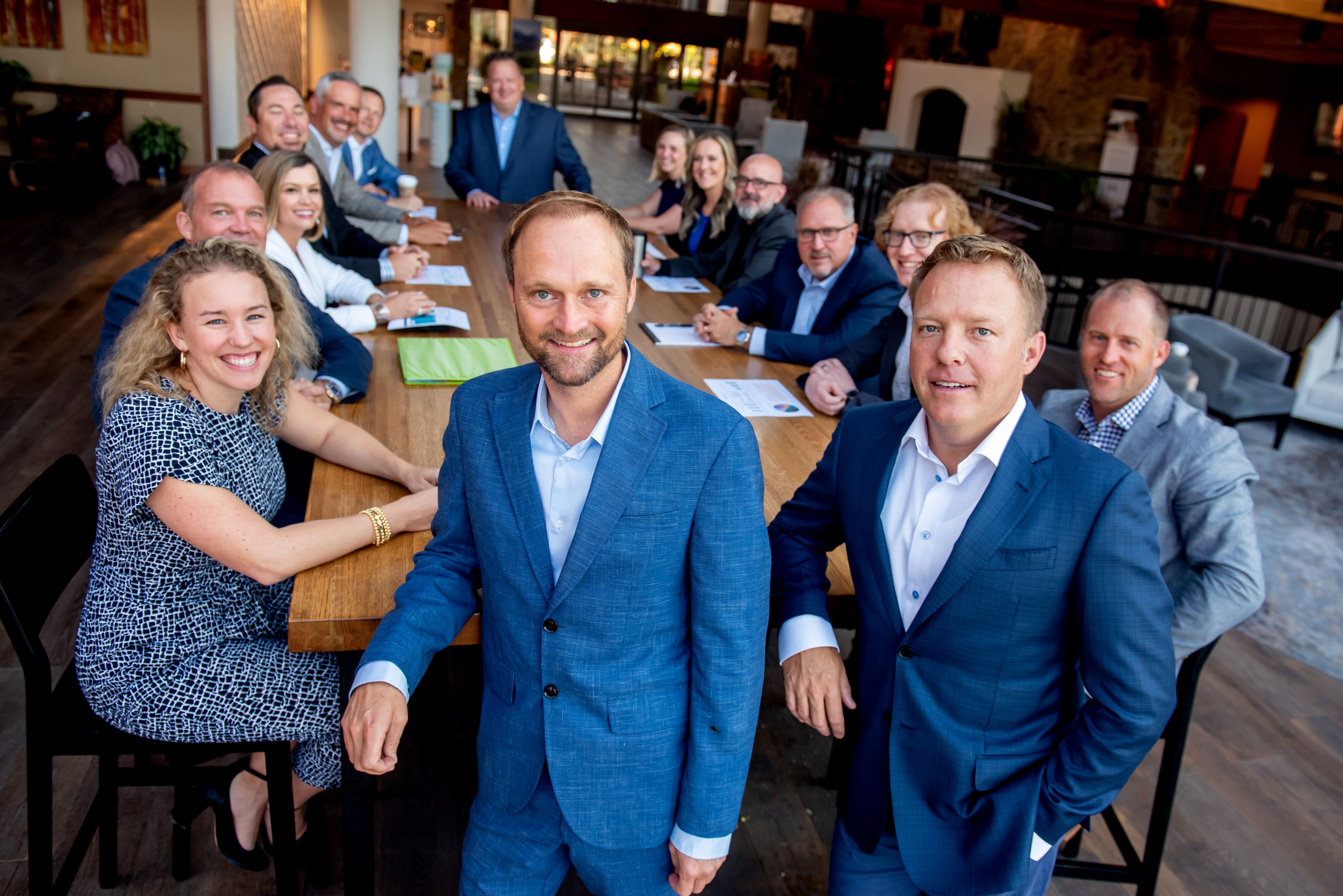 Intero Digital’s leadership team gathered around a long table in a photograph published in 2023