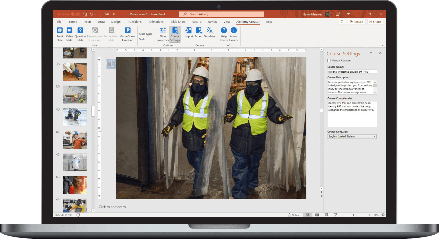 Alchemy course authoring displayed on a monitor beside frontline workers