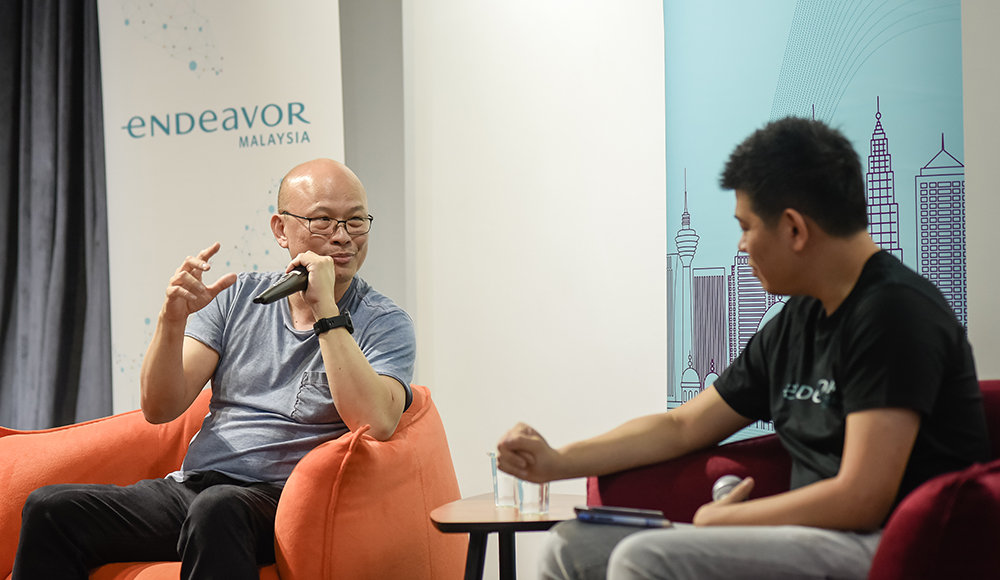 Peng Tsin Ong, left, in conversation with Leow Wee Jonn at an entrepreneurship event