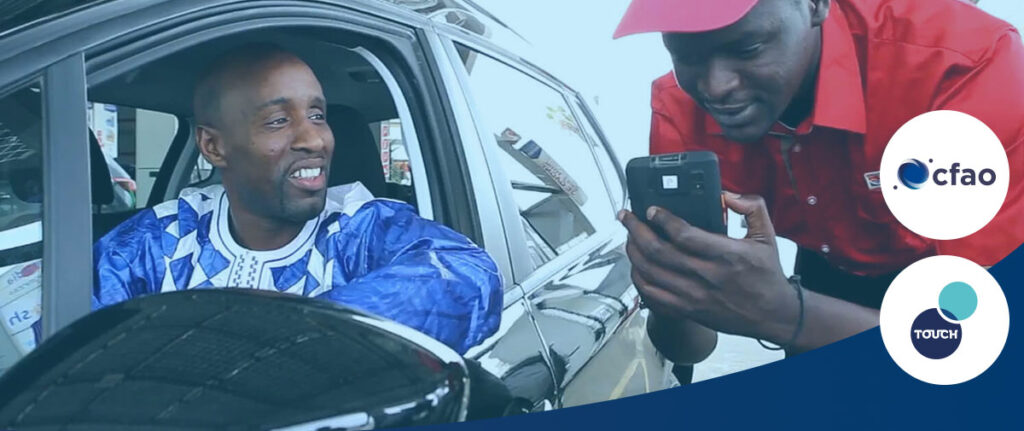 Customer in a vehicle and service-station attendant using a smartphone