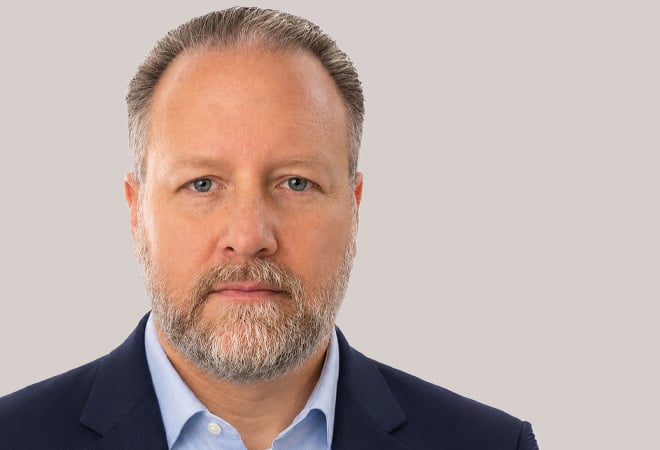 Company portrait of Intrado CEO Damon Covey