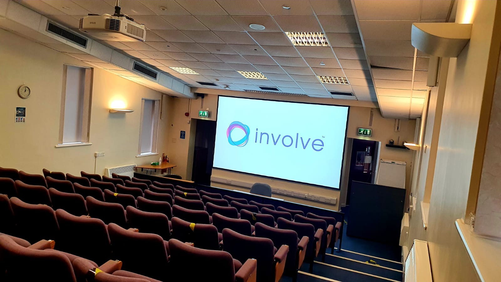 A tiered lecture theatre with projection equipment, photographed for Involve’s Mid Yorkshire project