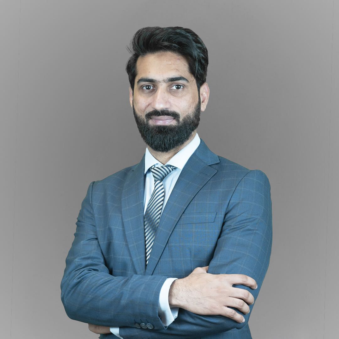 Furqan Aziz, InvoZone founder and CEO, in a blue checked suit