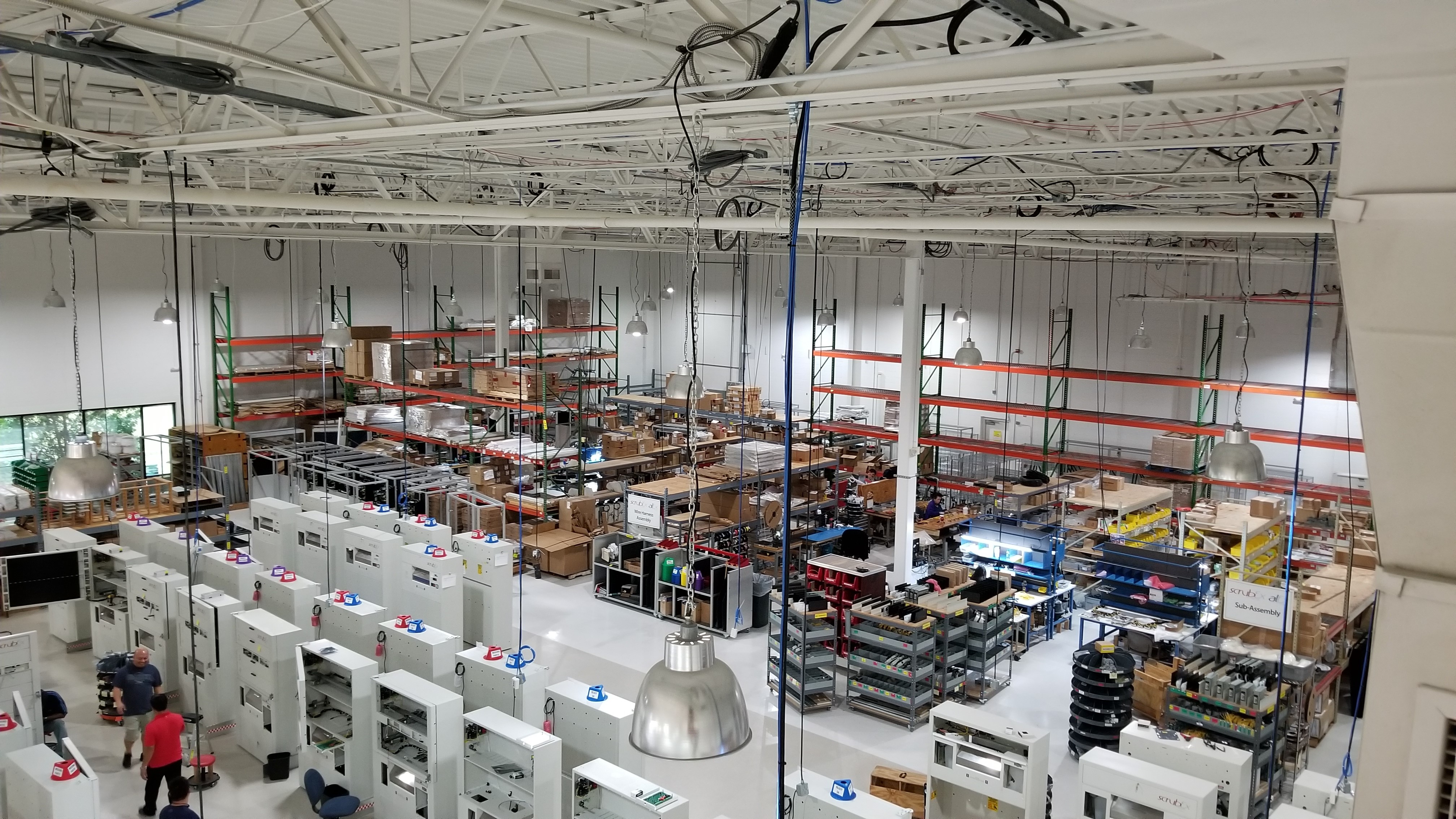 IPA production floor with rows of dispensing cabinets being assembled