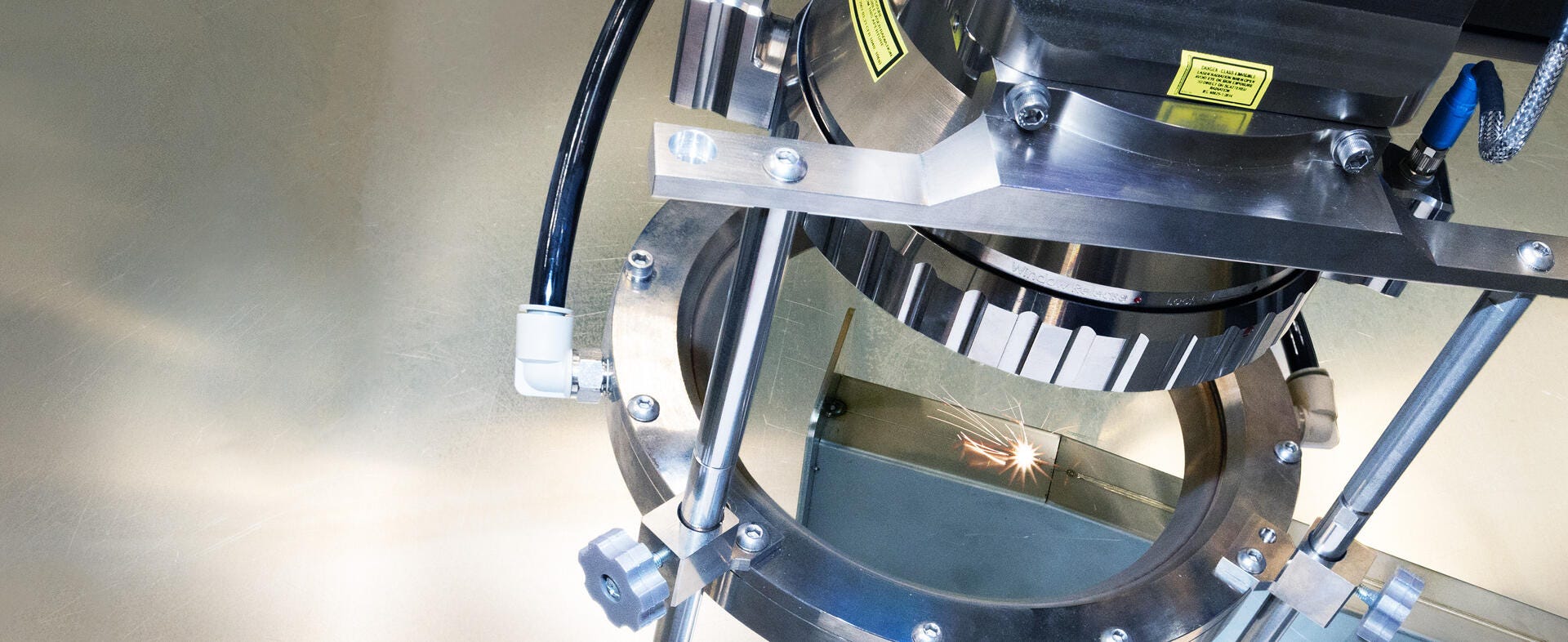 IPG laser processing head welding a metal component