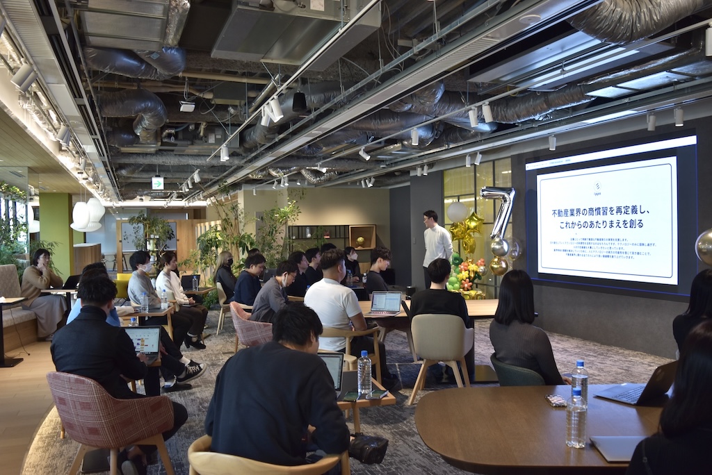 IPPO employees gathered for a presentation at the company's eighth-year kickoff event