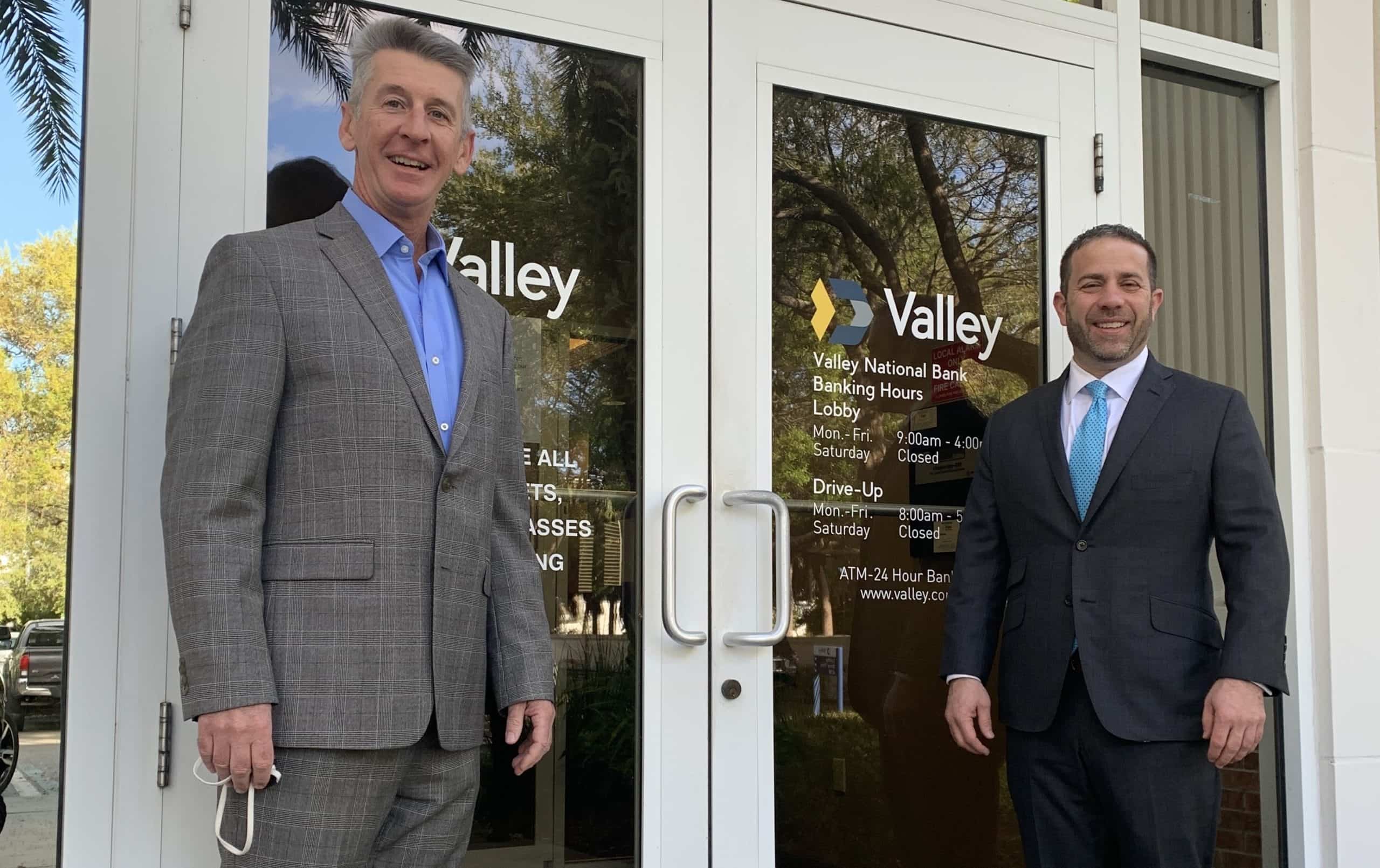 Jeff Armstrong, left, and Ira Robbins, right, standing outside a Valley branch
