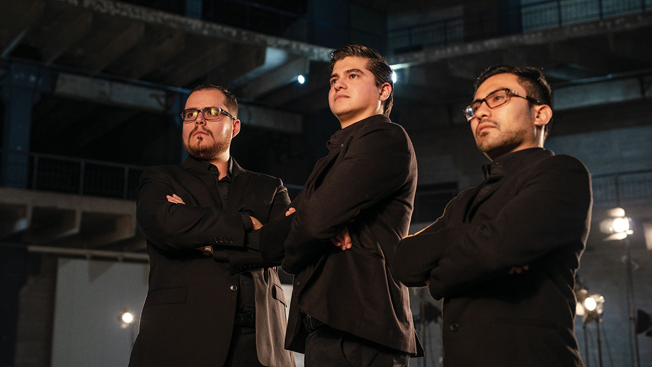 Irving Rivera standing with two Solena co-founders in a studio portrait