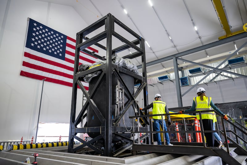 Workers prepare reactor equipment inside Valar Atomics' Utah facility