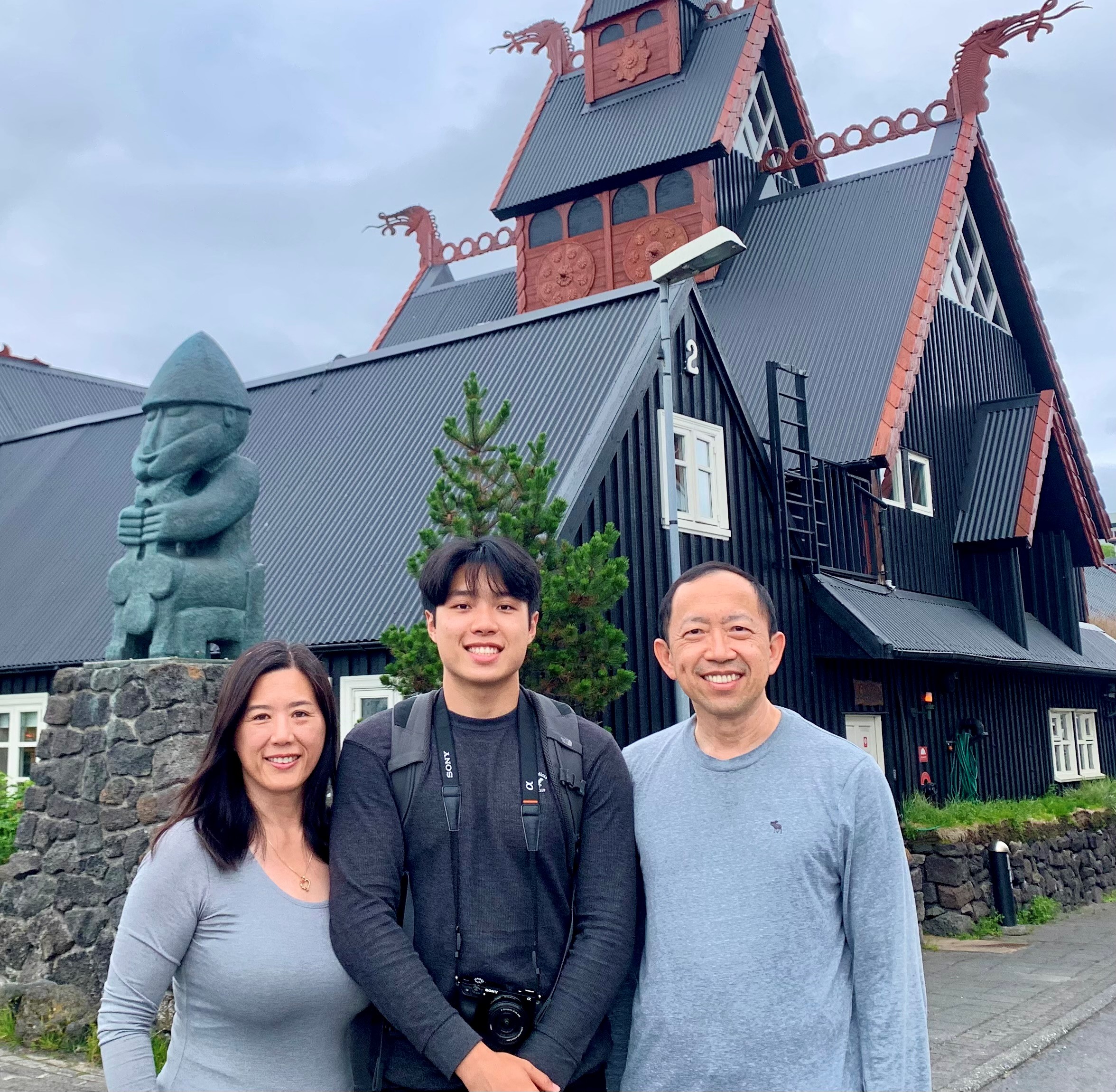 Grace Shiao, Ethan, and Isan Chen smiling together in a family photograph