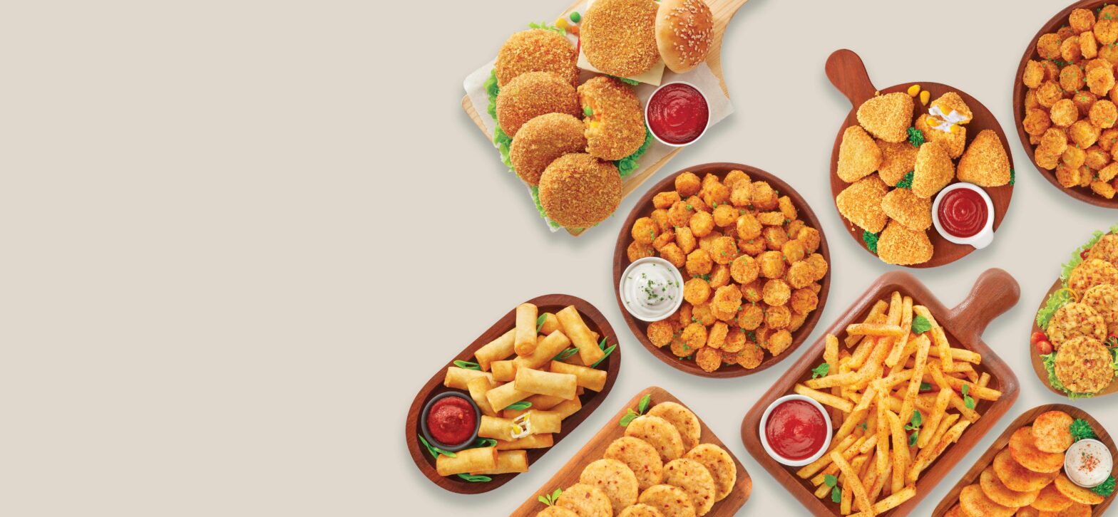 Iscon Balaji’s prepared fries, patties and coated vegetarian snacks arranged on wooden serving dishes