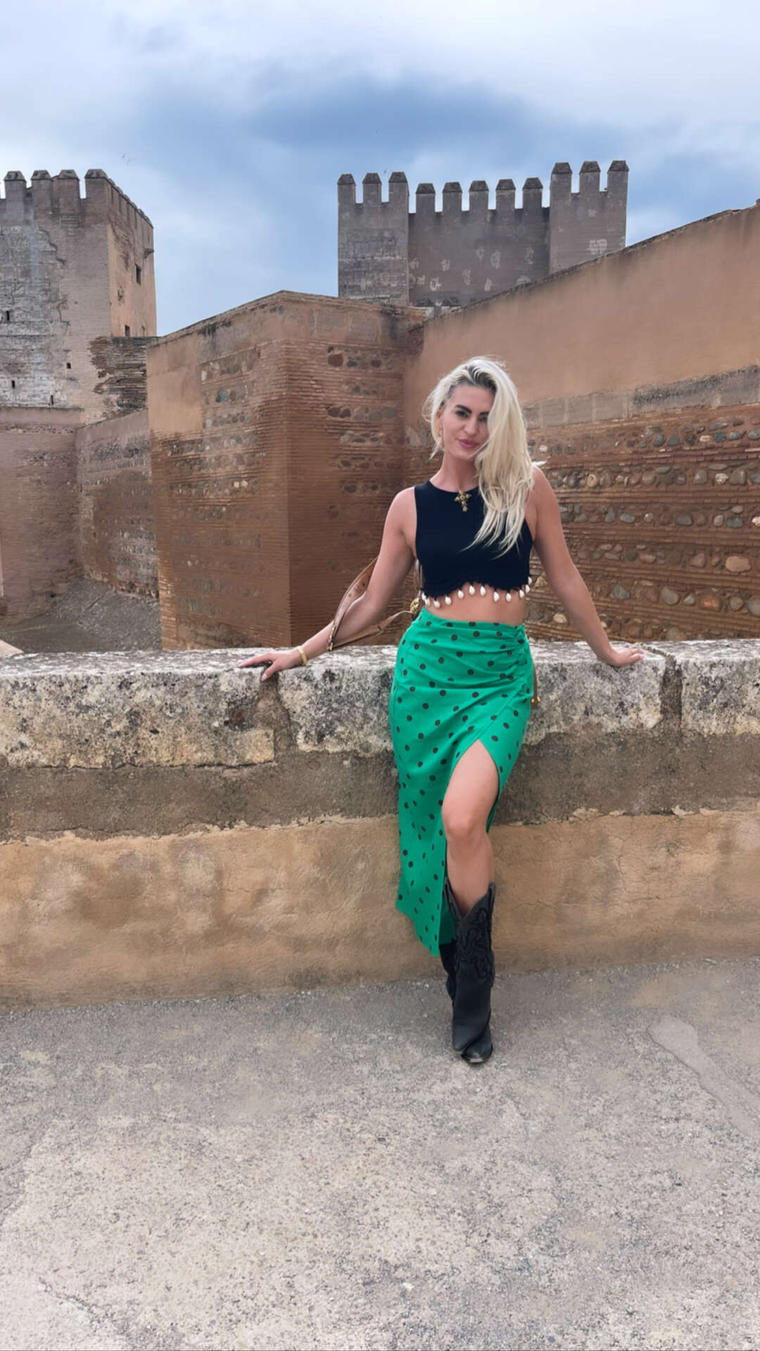 ISET Agency founder Adelheid Waumboldt standing before historic architecture