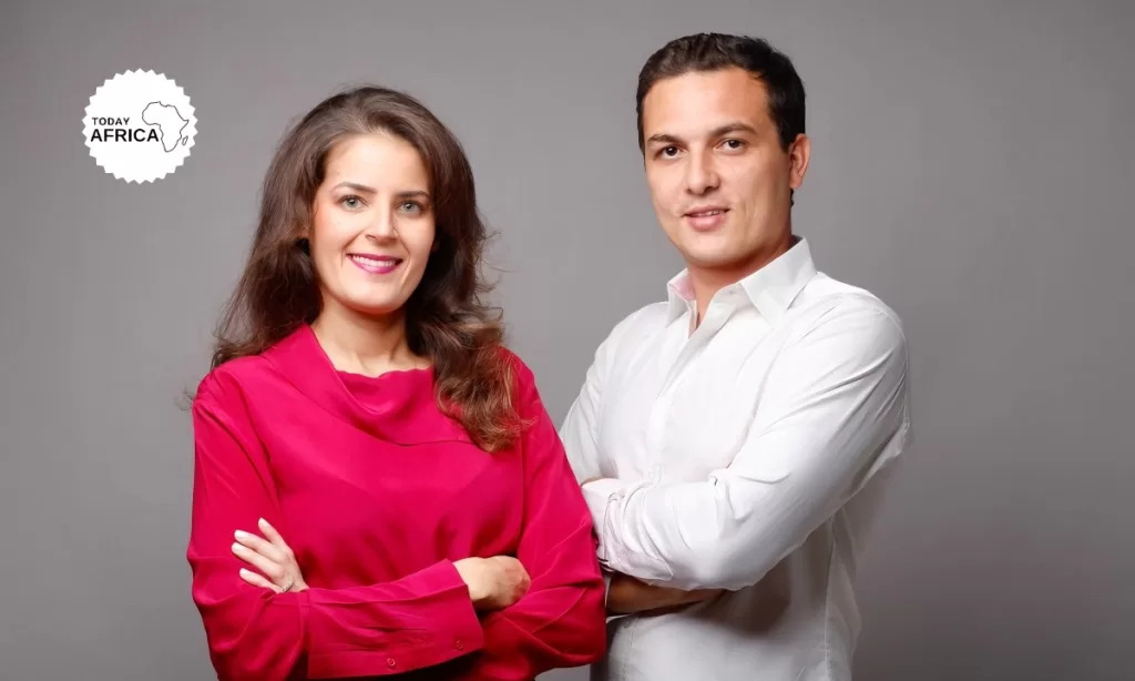 Sophia Alj and Ismael Belkhayat standing together against a gray studio background