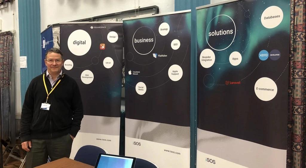 An iSOS exhibition stand displaying its database, design, app and support services