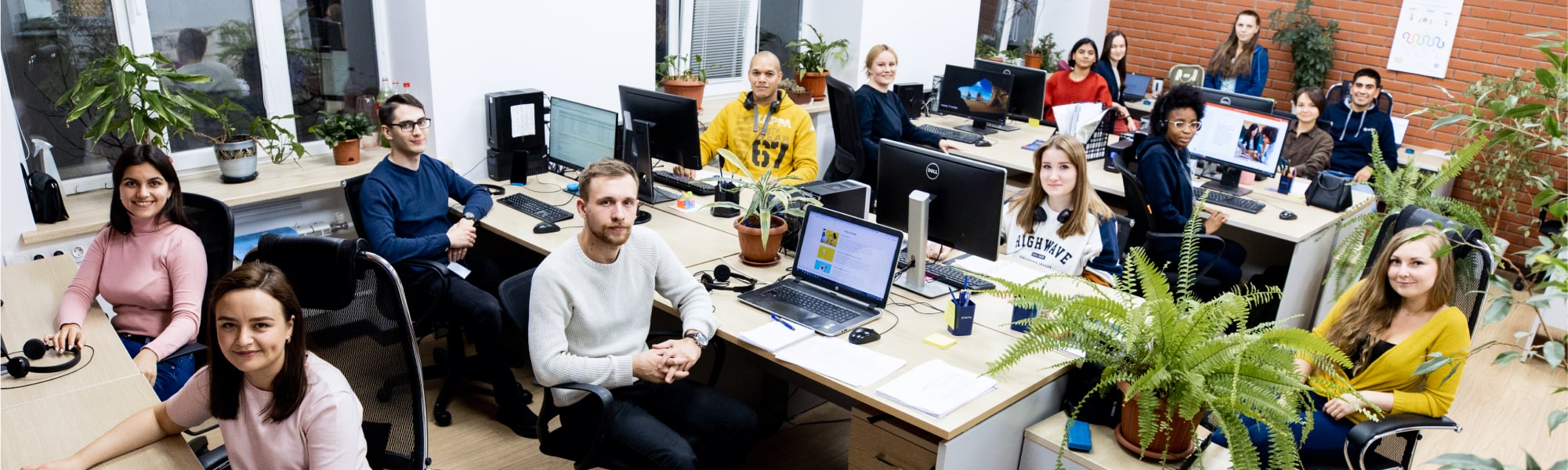 A group of iSpring employees outdoors in a team photograph from the company website