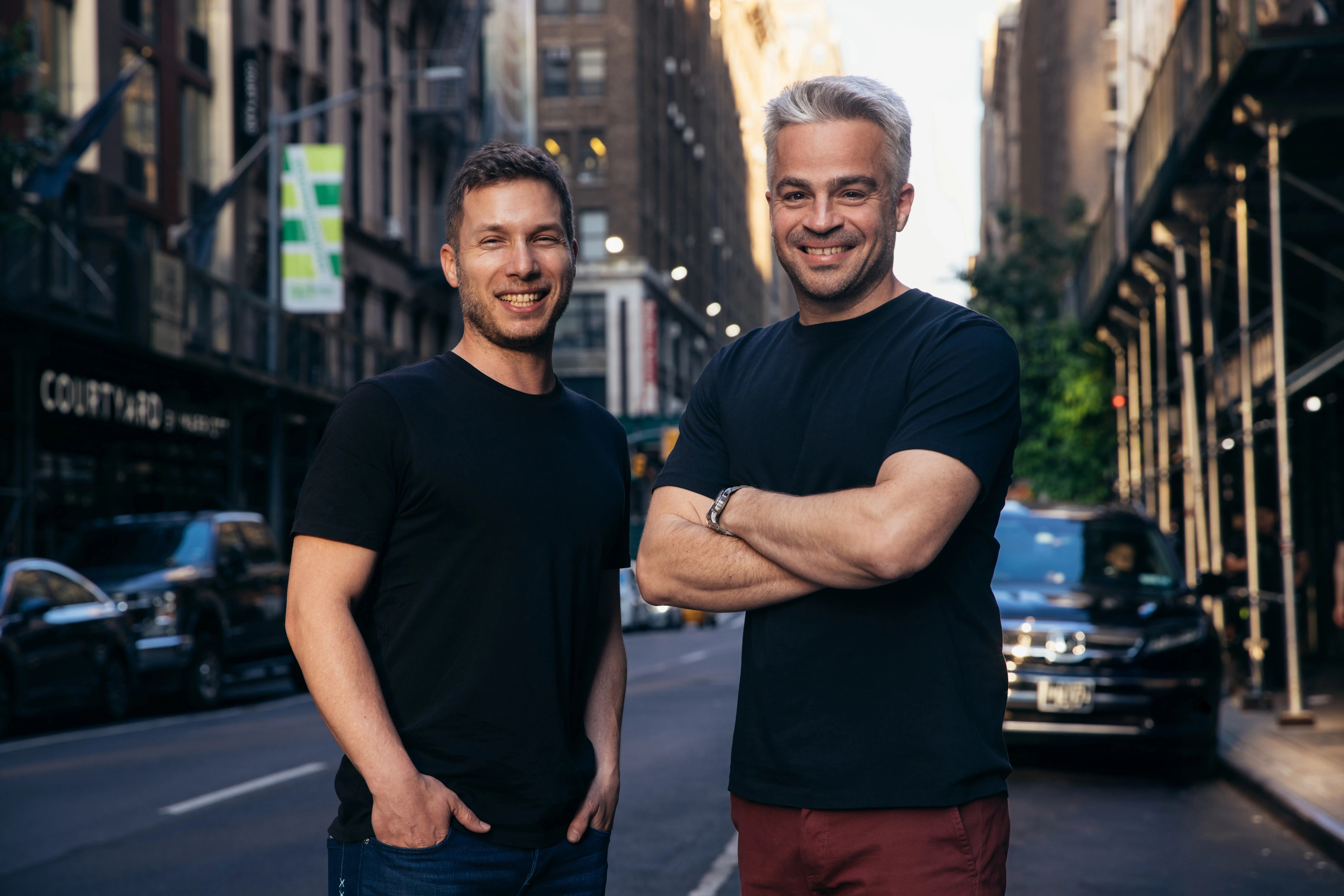 Linx co-founders Niv Goldenberg, left, and Israel Duanis, right, standing on a city street