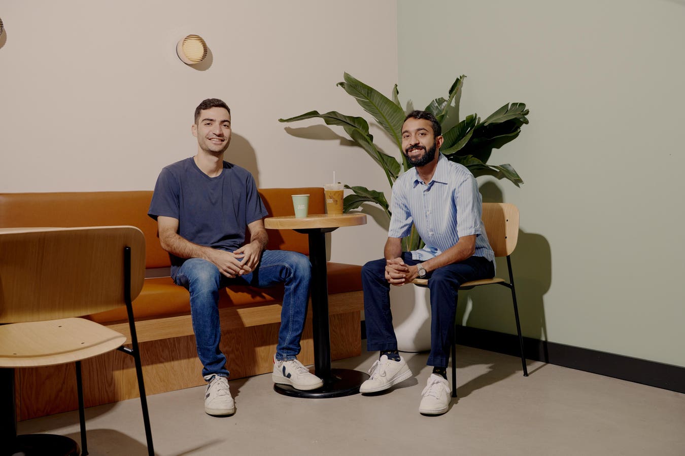 Issam Freiha and Vinay Menda seated inside a Blank Street coffee shop