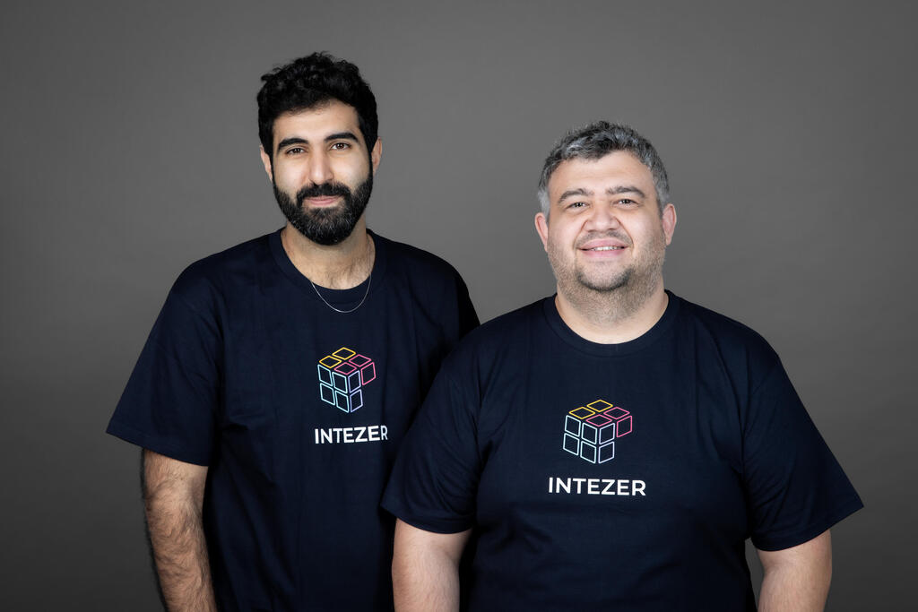 Intezer co-founders Roy Halevi and Itai Tevet wearing company T-shirts