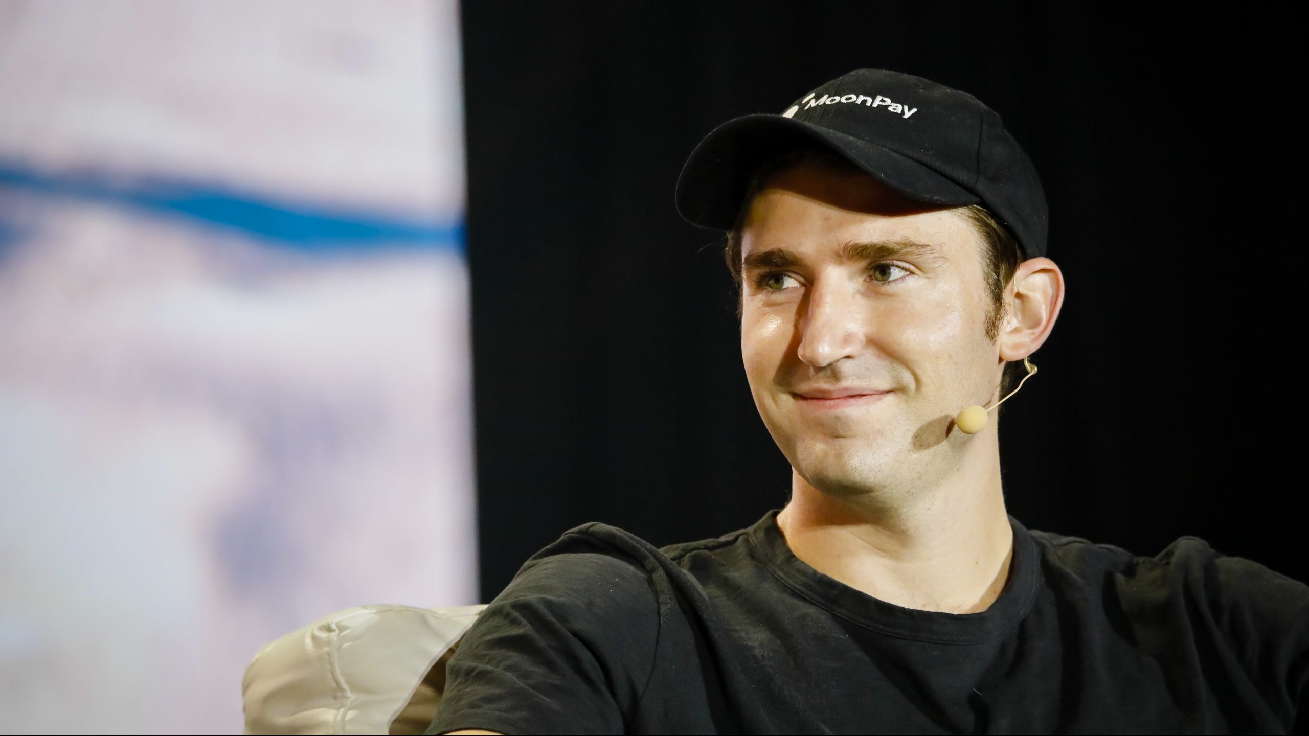 Ivan Soto-Wright wearing a MoonPay cap and headset microphone at Bitcoin 2021 in Miami