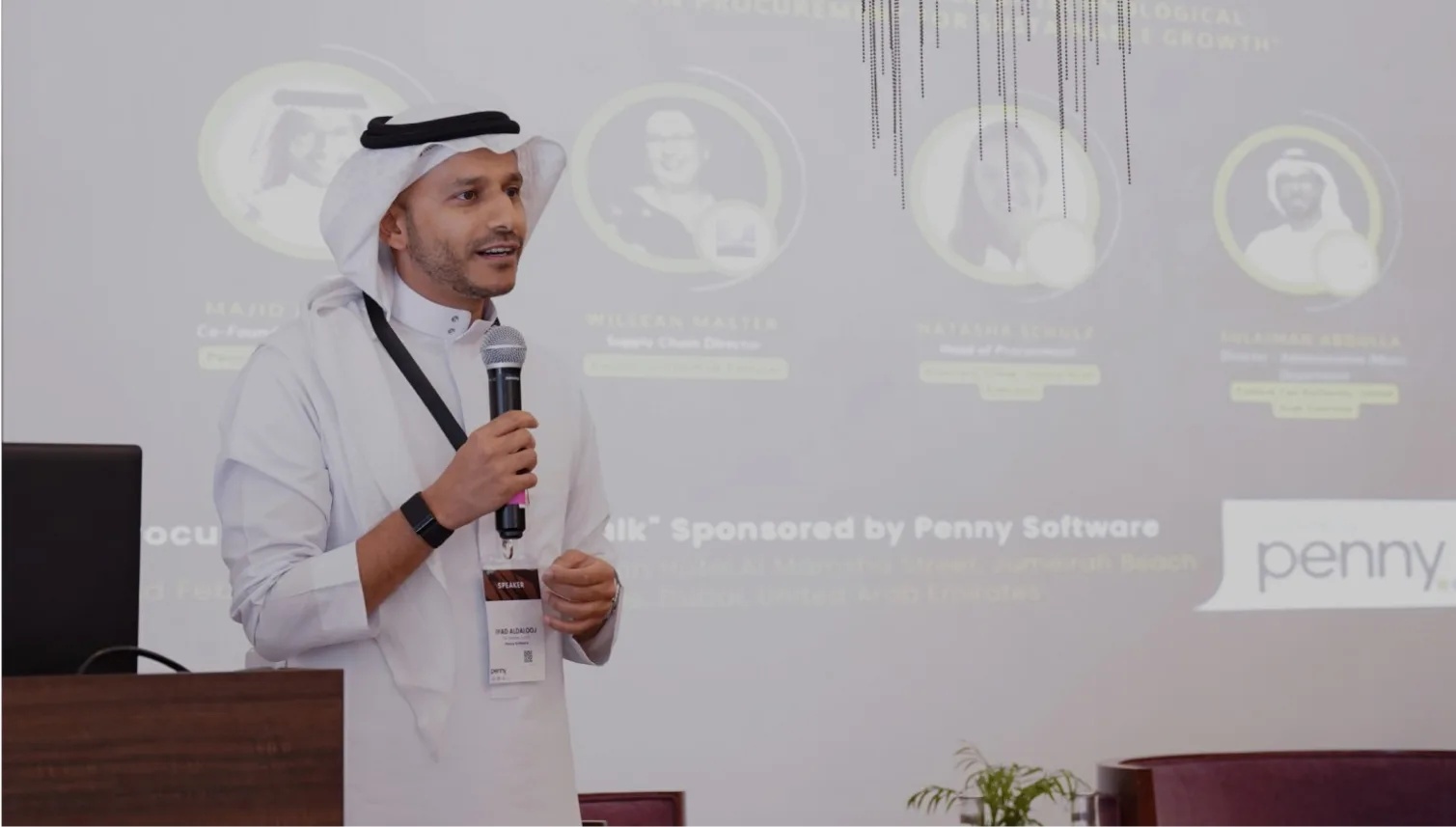 Iyad Aldalooj speaking into a microphone at a Penny procurement event