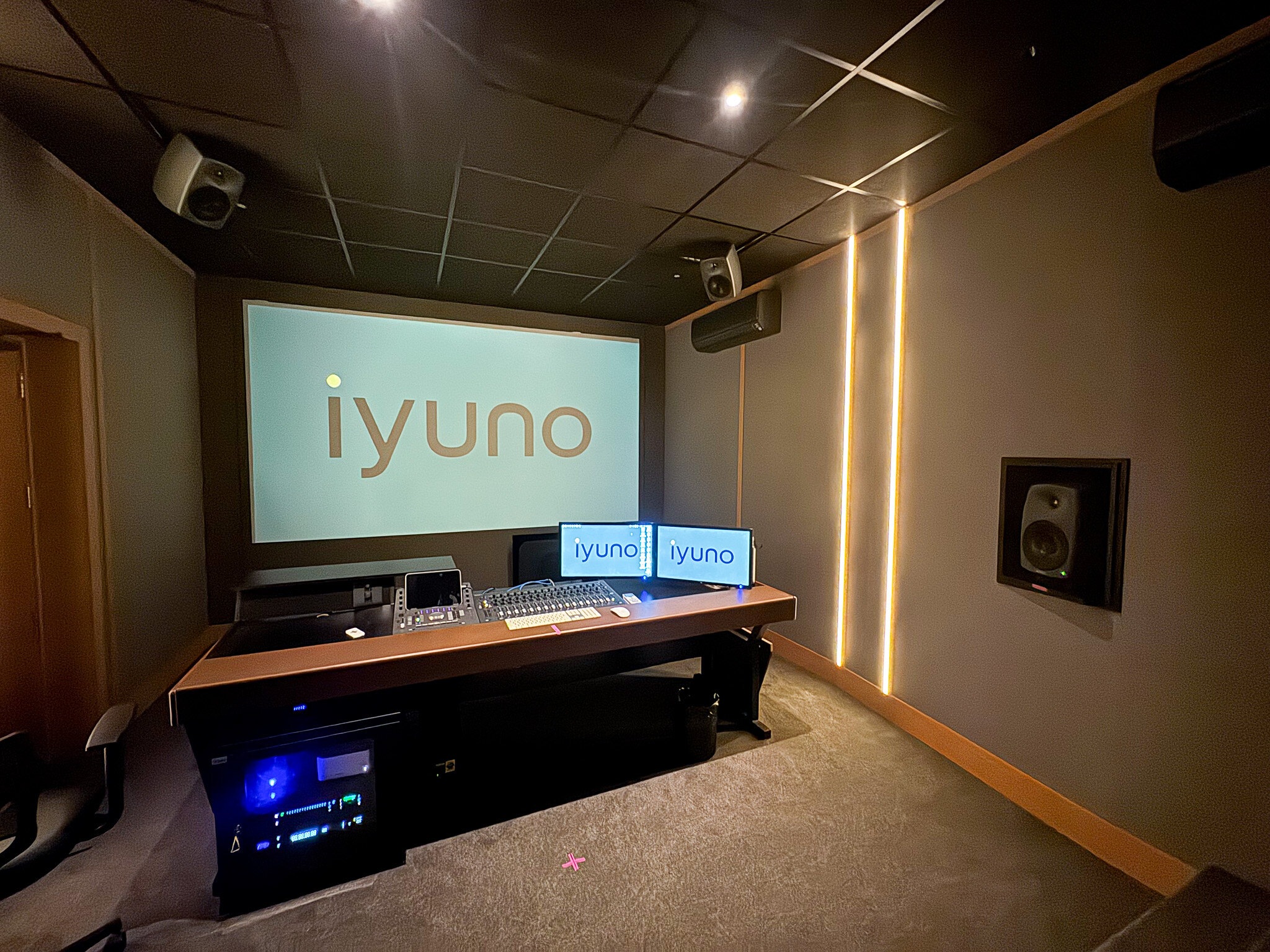 Mixing console, screen and acoustic treatment in Iyuno’s São Paulo studio