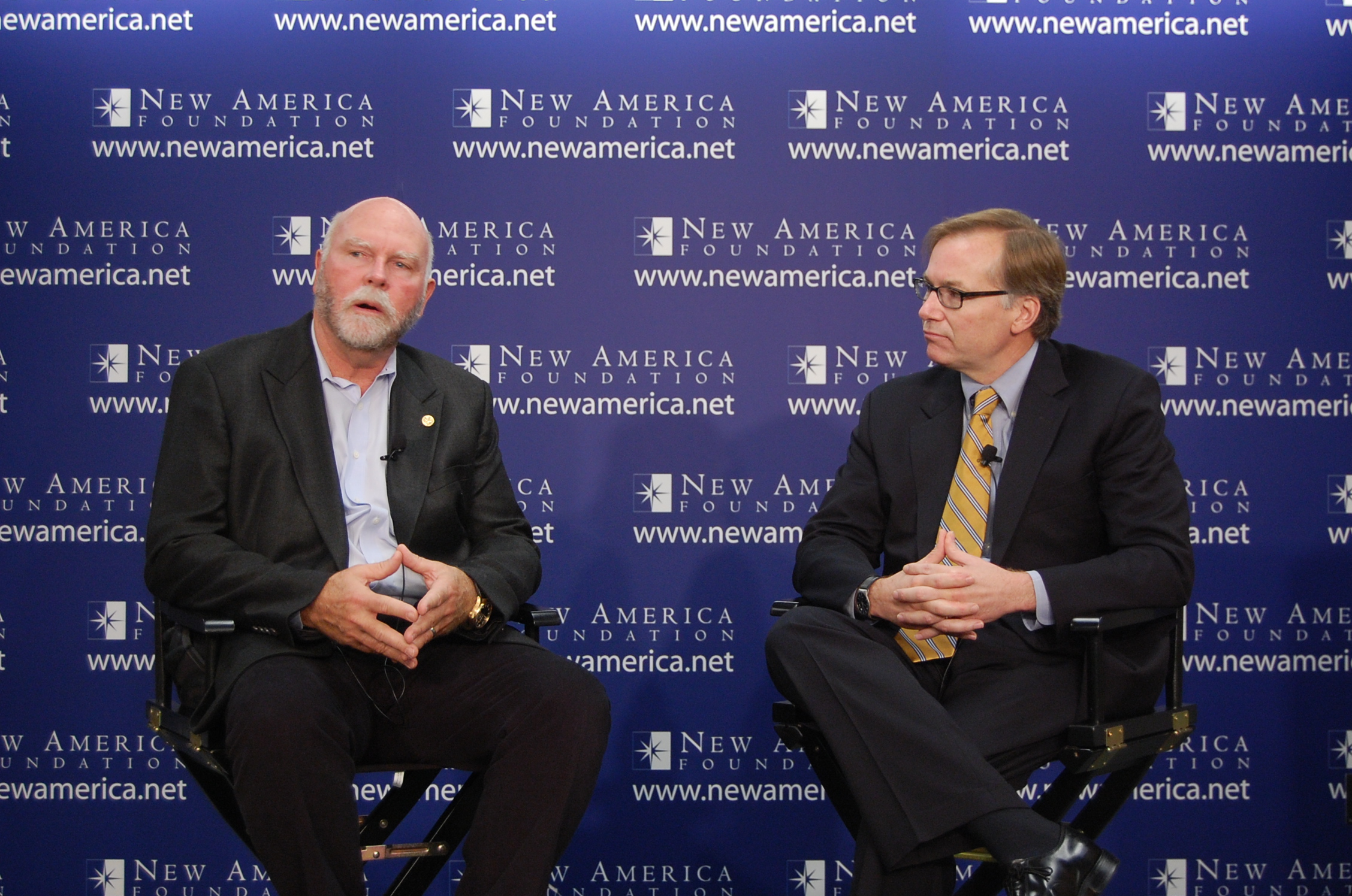 Craig Venter, at left, speaking with Steve Coll on stage at a New America event in 2011.