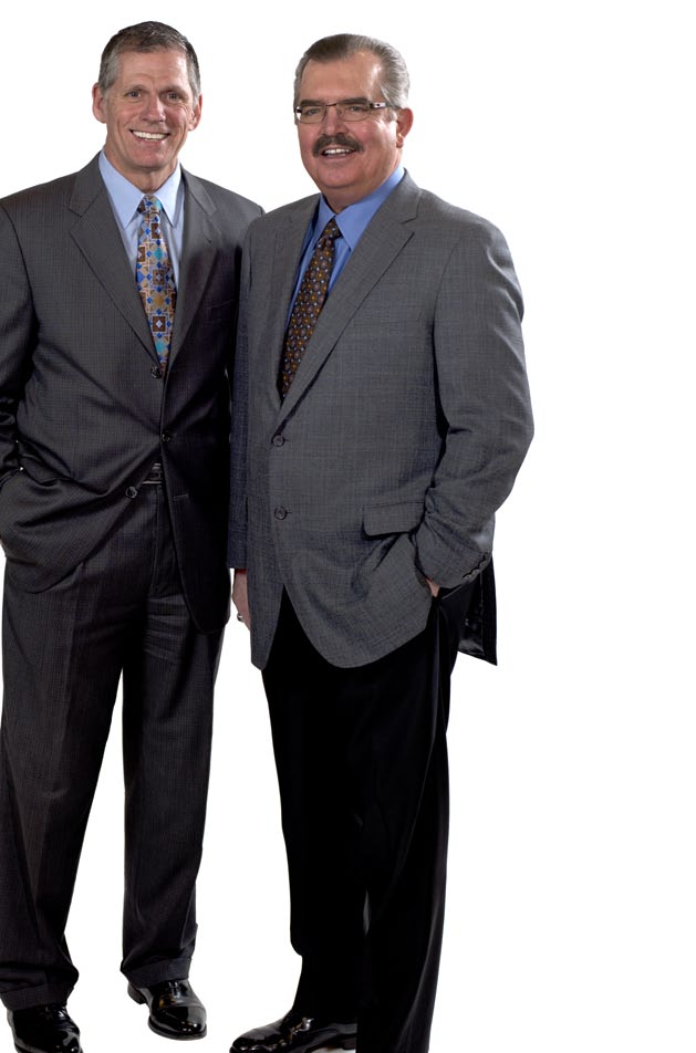 Darrel Anderson on the left and J. LaMont Keen on the right, standing together in suits