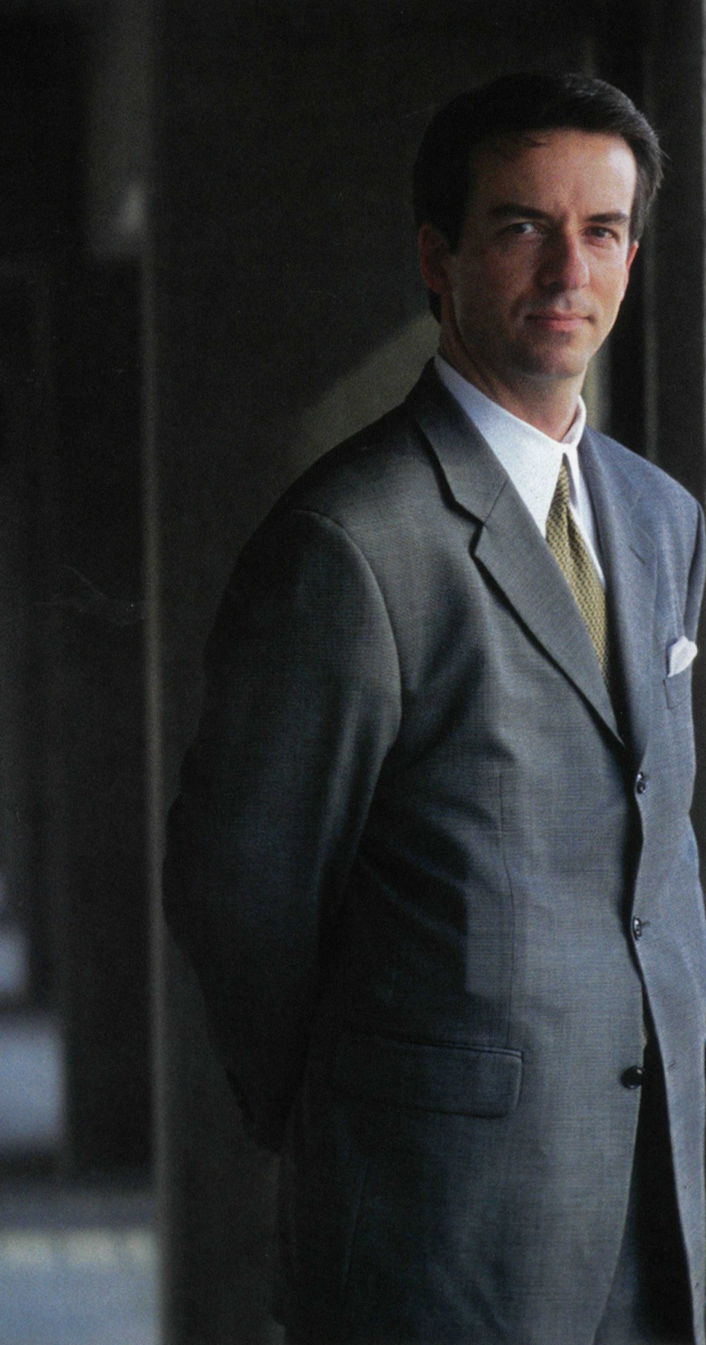J. Michael Robison standing in a parking structure in a 2006 magazine photograph