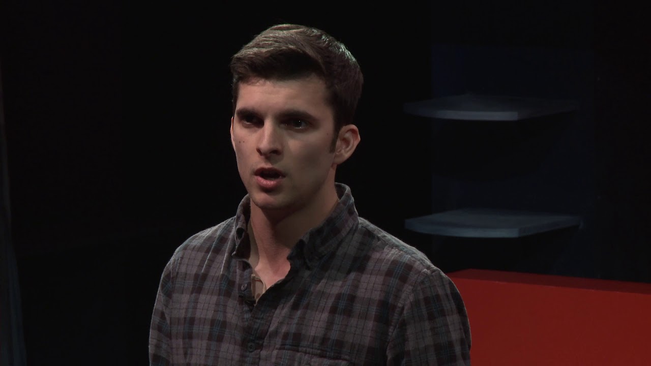 Jack Kendall speaking on the TEDxUF stage