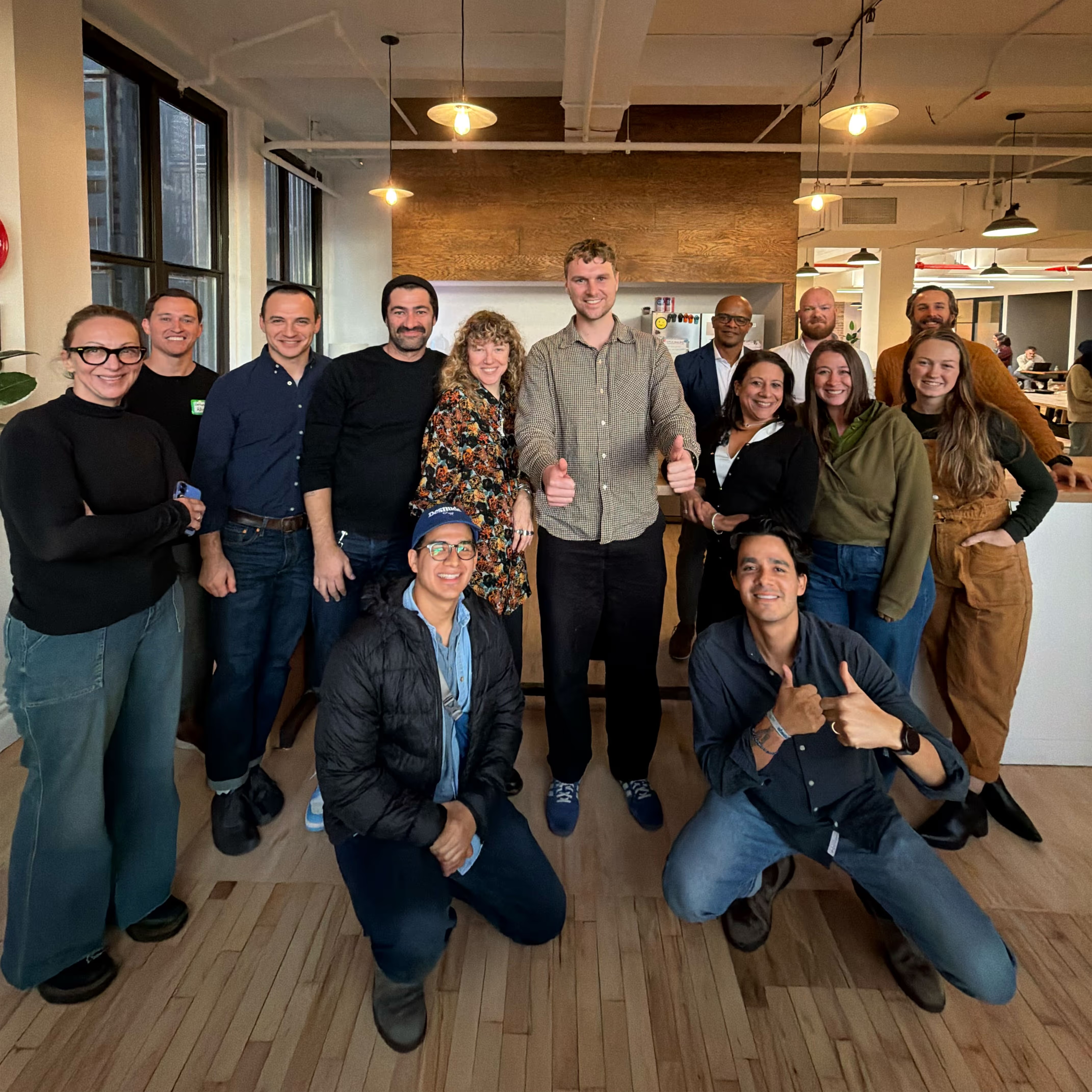 Jack Pawlik, at center with two thumbs up, alongside the Dripos team