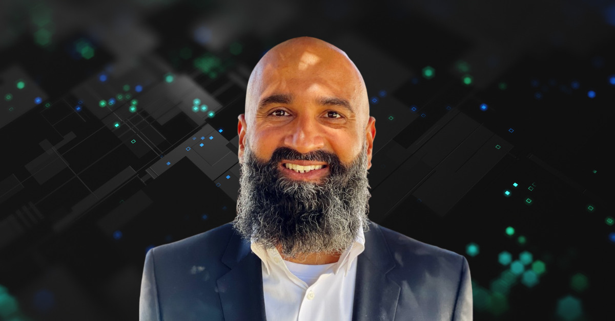 Jack Singh in a dark jacket against an abstract digital background