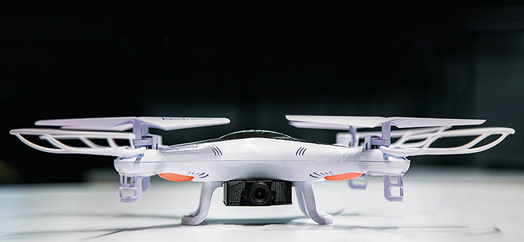 Rook indoor drone, with a camera below its white body