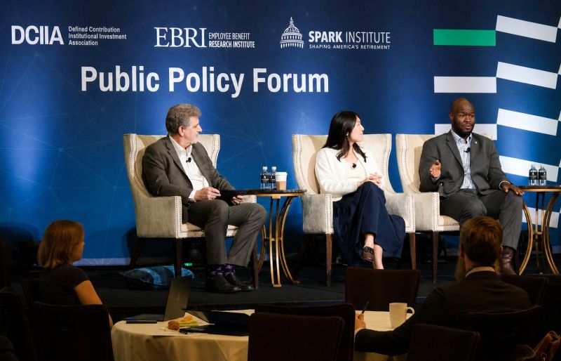Jaclyn Chen seated between Paul Fronstin and Kevin Gaston onstage at the 2026 Public Policy Forum