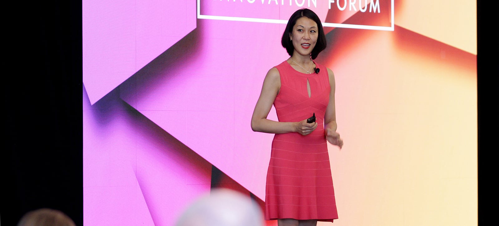 Jacquelyn Kung speaking onstage at the Senior Living Innovation Forum in 2018
