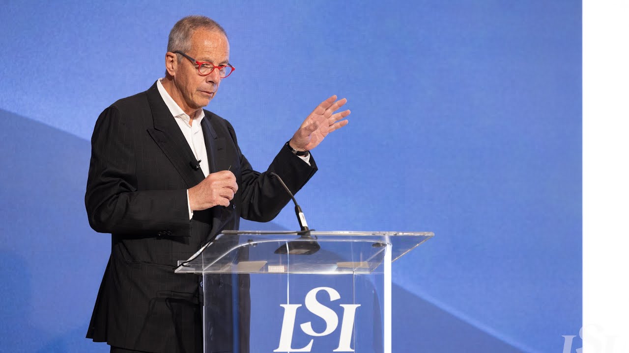 Jacques Essinger speaking at a lectern at LSI USA 2024